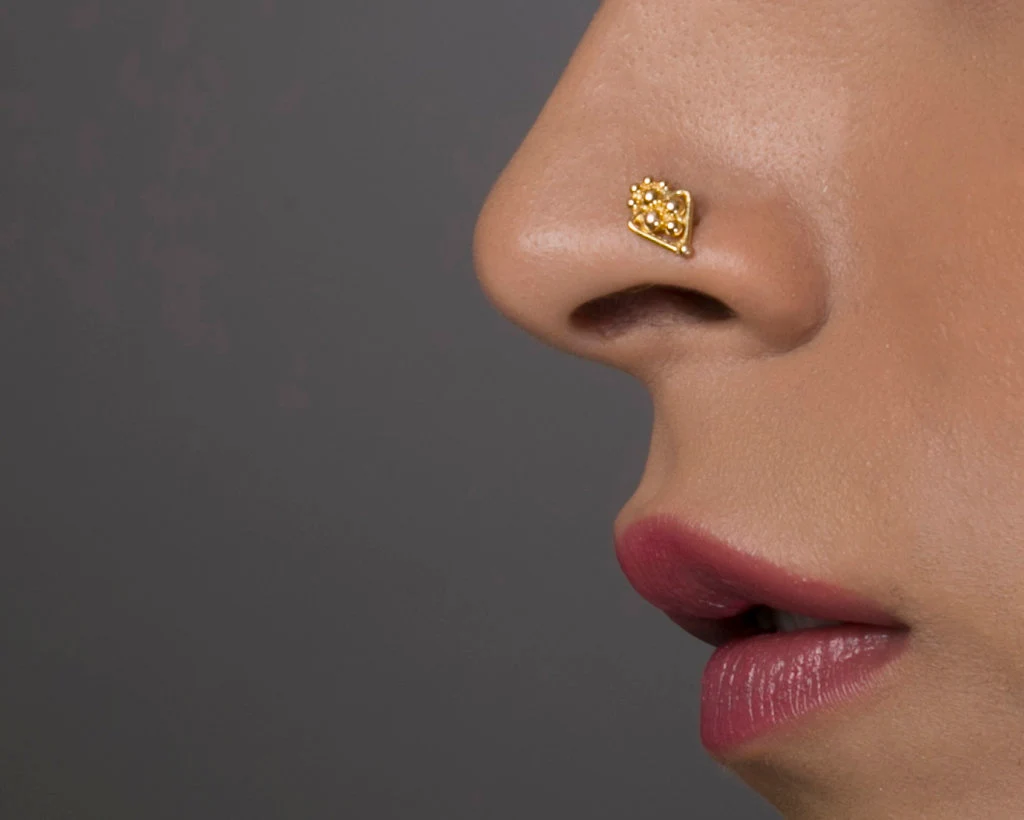Traditional Gold-Toned Floral Nose Pin with Textured Detailing